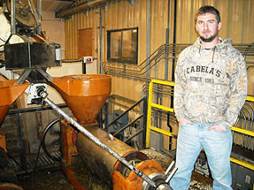 Jake Madison with the Canola crusher.